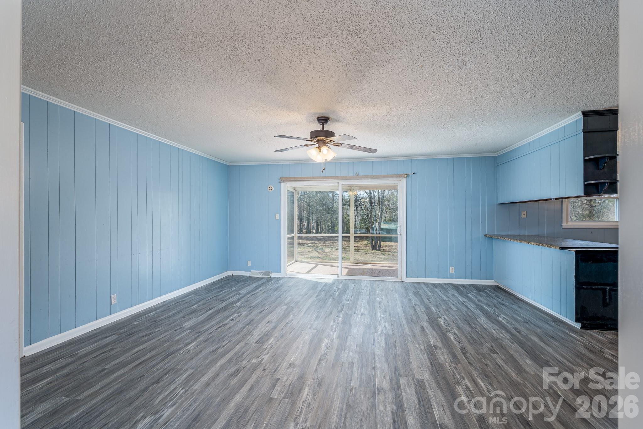 3439 Filbert Highway Clover, SC 29710 - Photo 9 of 28 a view of an empty room with a window and wooden floor