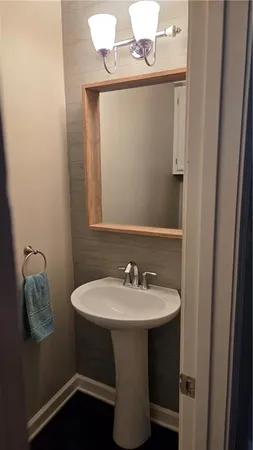 a bathroom with a toilet and a sink
