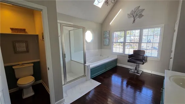 a bathroom with a bathtub and a shower