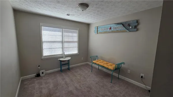 a view of livingroom with furniture and windows