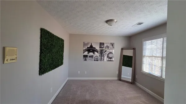 a bathroom with a sink a toilet a mirror and shower