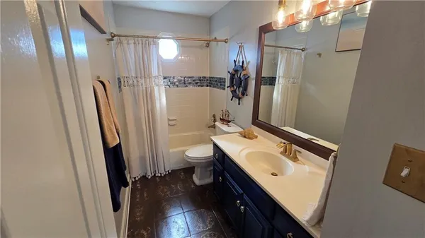 a kitchen with stainless steel appliances a refrigerator and a stove top oven