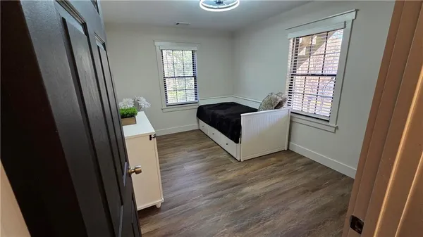 a workspace with furniture and wooden floor