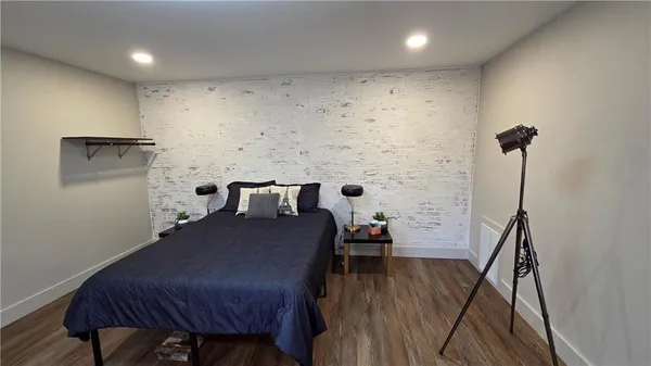 a bathroom with a sink toilet and mirror