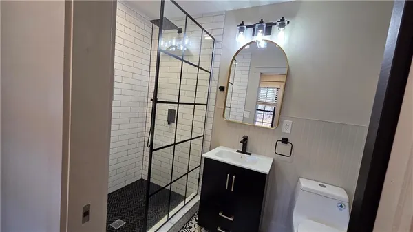 a view of house with deck and outdoor seating