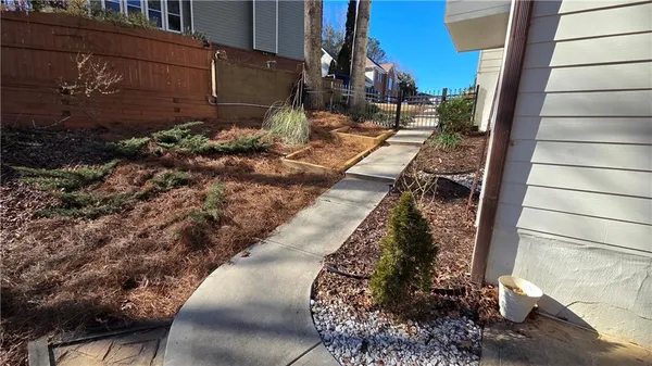a view of a patio with dining table and chairs
