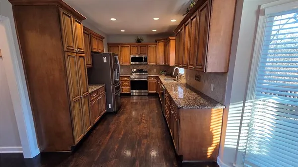 a view of living room with furniture and a window