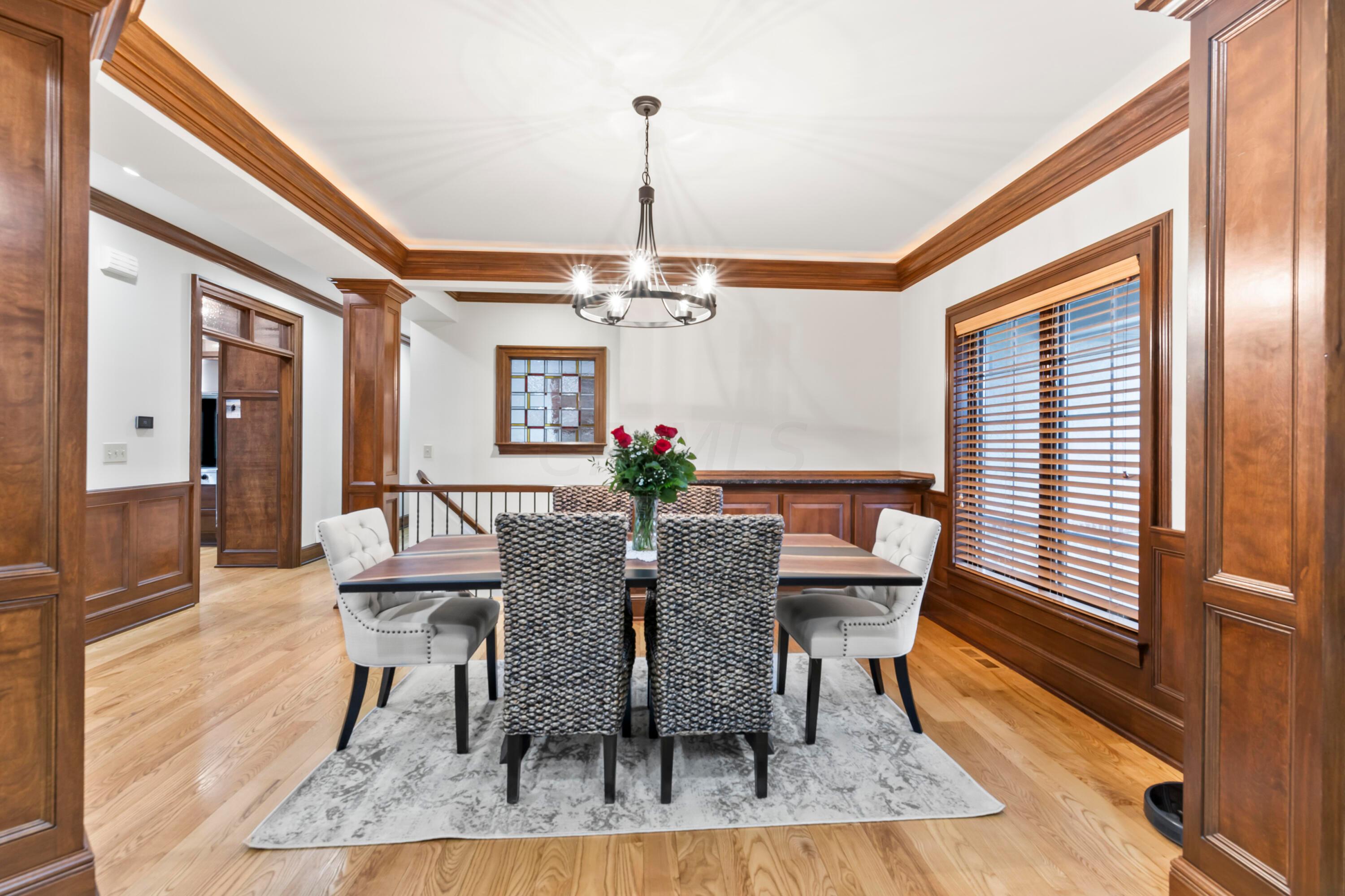 6043 Dublin Road Delaware, OH 43015 - Photo 6 of 98 • Hardwood flooring
• Ivory painted & wainscoted
walls
• Chandelier
• Buffet counter with granite
ledge
• Tray ceiling
• Crown molding
• 2” blinds