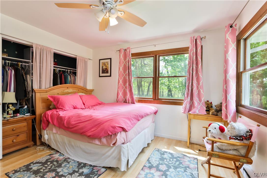 921 Point Phillips Road Bath, PA 18014 - Photo 11 of 29 a bedroom with a bed and wooden floor