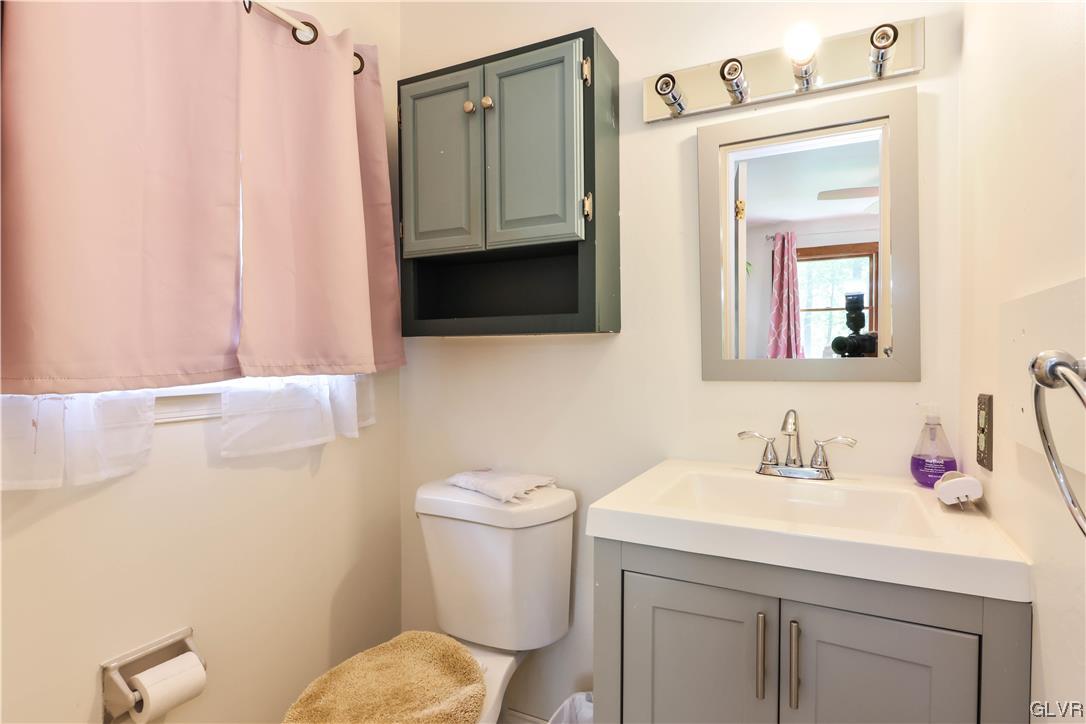 921 Point Phillips Road Bath, PA 18014 - Photo 12 of 29 a bathroom with a toilet sink and mirror