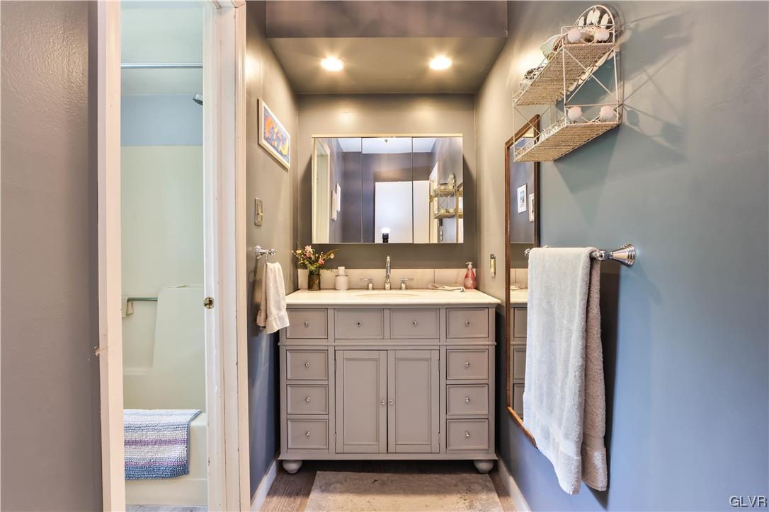 921 Point Phillips Road Bath, PA 18014 - Photo 13 of 29 a bathroom with a sink mirror and a shower