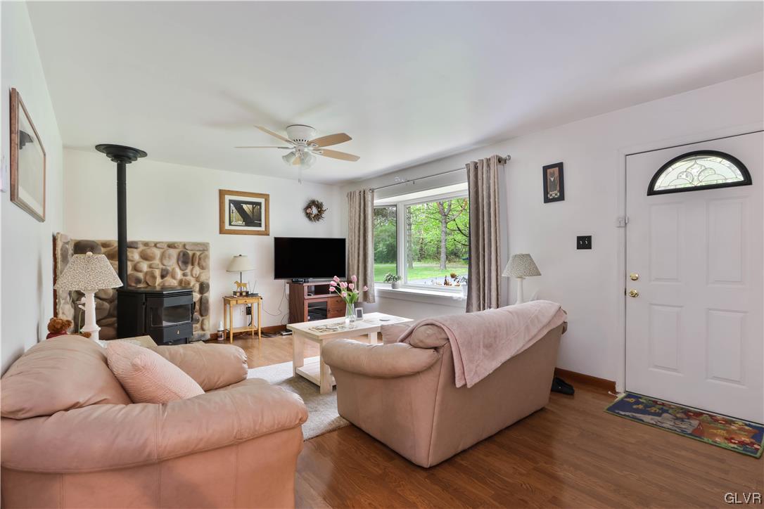 921 Point Phillips Road Bath, PA 18014 - Photo 2 of 29 a living room with furniture and a flat screen tv