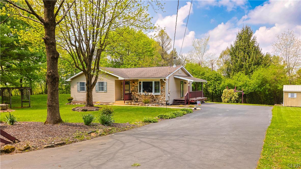 921 Point Phillips Road Bath, PA 18014 - Photo 21 of 29 a front view of a house with garden and trees