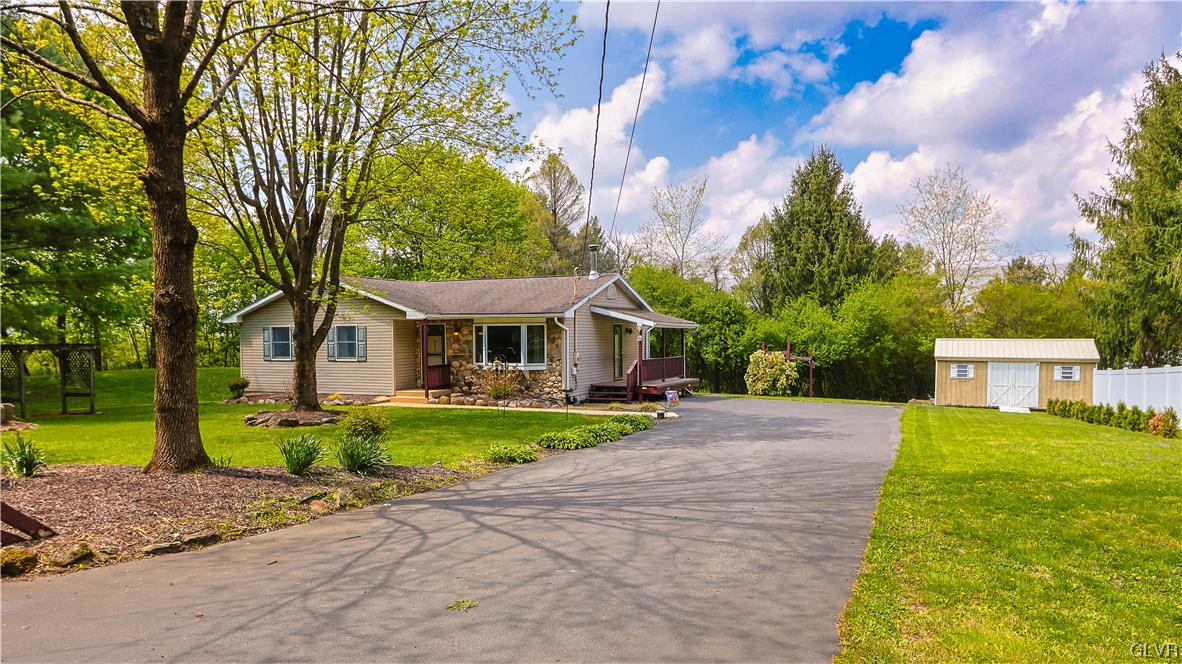 921 Point Phillips Road Bath, PA 18014 - Photo 22 of 29 a front view of a house with a yard table and chairs