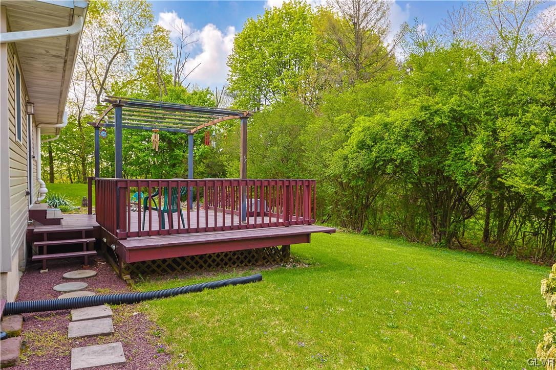 921 Point Phillips Road Bath, PA 18014 - Photo 25 of 29 a view of a wooden deck with a yard