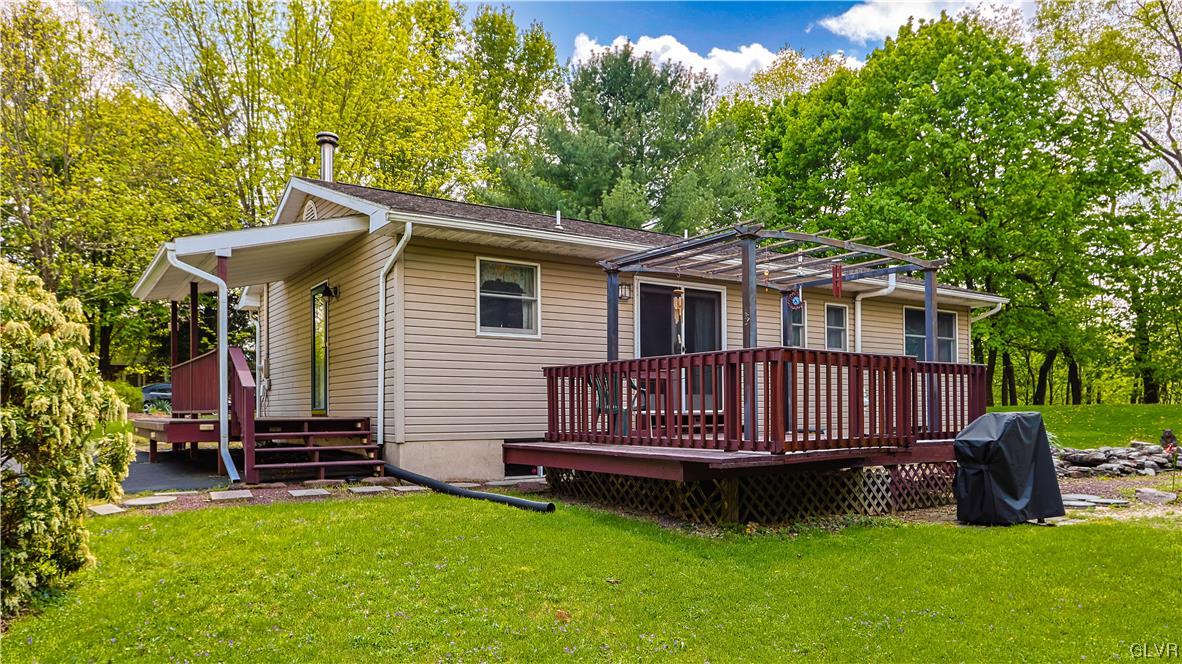 921 Point Phillips Road Bath, PA 18014 - Photo 26 of 29 a view of a house with a deck and a yard