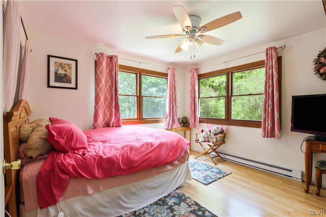 921 Point Phillips Road Bath, PA 18014 - Photo 10 of 29 a bedroom with a bed and a flat screen tv