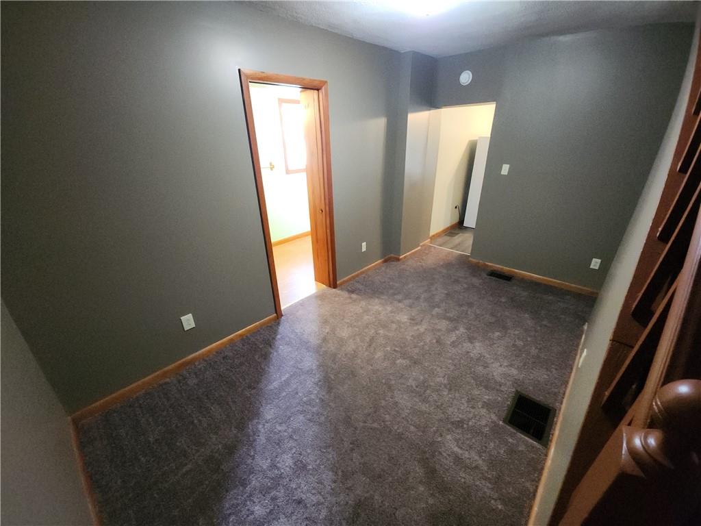 8 Elm Street Bessemer, PA 16112 - Photo 13 of 22 an empty room with windows