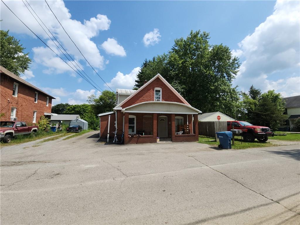 8 Elm Street Bessemer, PA 16112 - Photo 3 of 22 a view of a house with large space and a car parked beside it