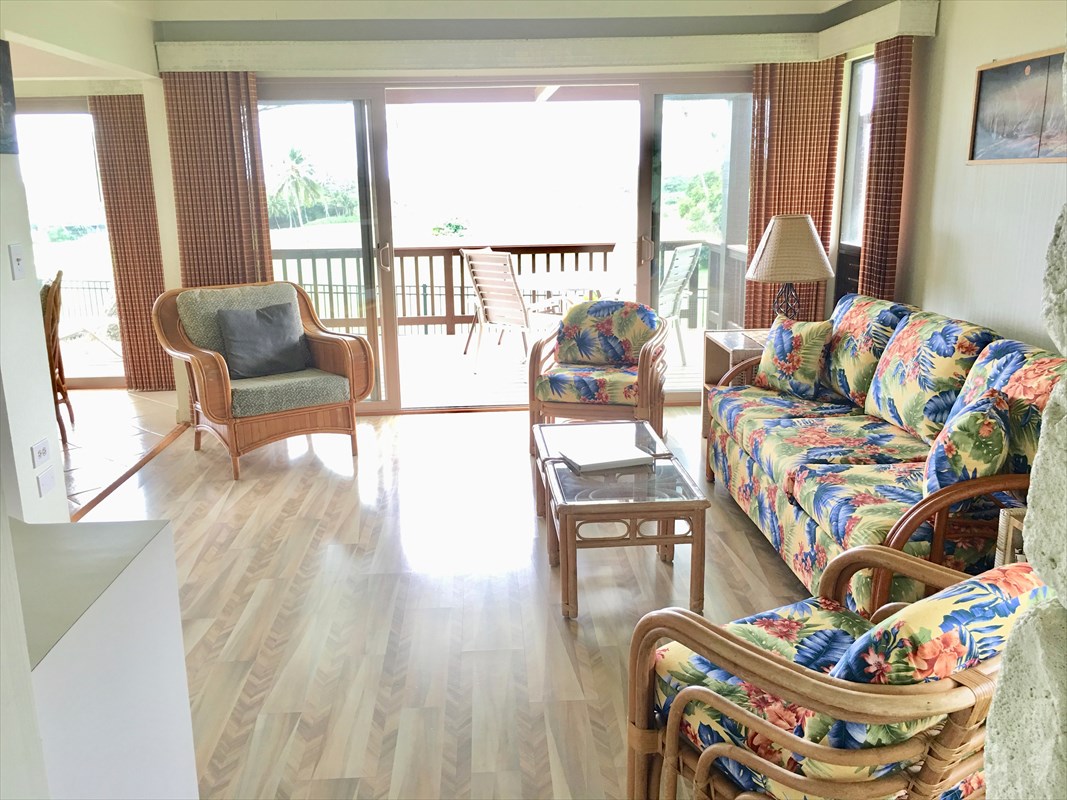 a living room with furniture and a large window