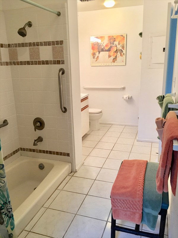 95-789 Ninole Loop Road, Unit 42 Naalehu, HI 96772 - Photo 12 of 17 a bathroom with a toilet and a shower
