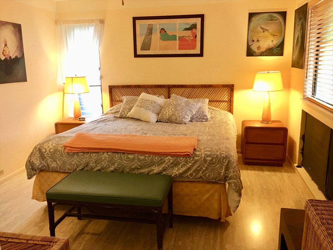 95-789 Ninole Loop Road, Unit 42 Naalehu, HI 96772 - Photo 17 of 17 a bedroom with a bed and wooden floor
