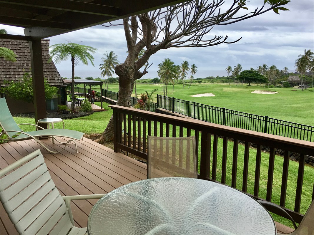 95-789 Ninole Loop Road, Unit 42 Naalehu, HI 96772 - Photo 4 of 17 a view of a patio with a table chairs and a backyard