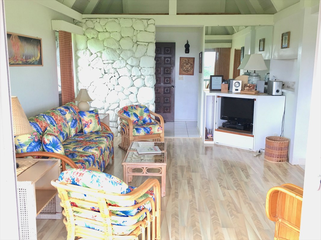 95-789 Ninole Loop Road, Unit 42 Naalehu, HI 96772 - Photo 6 of 17 a living room filled with furniture and a table