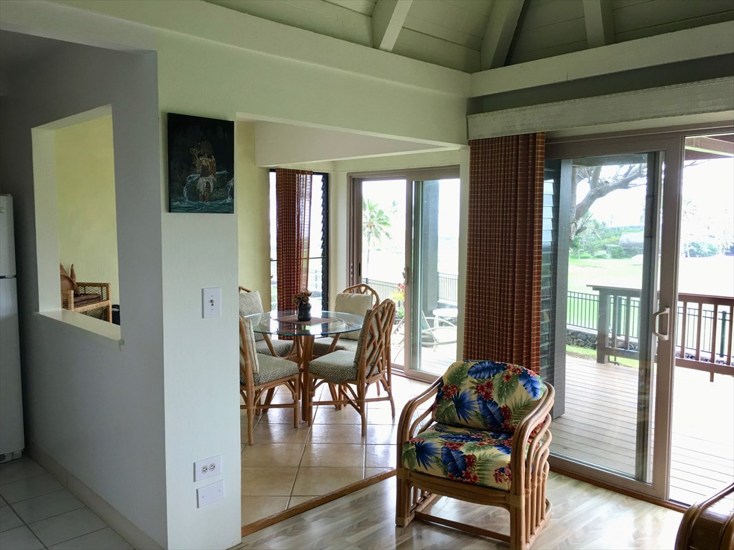 95-789 Ninole Loop Road, Unit 42 Naalehu, HI 96772 - Photo 7 of 17 a dining room with furniture and wooden floor