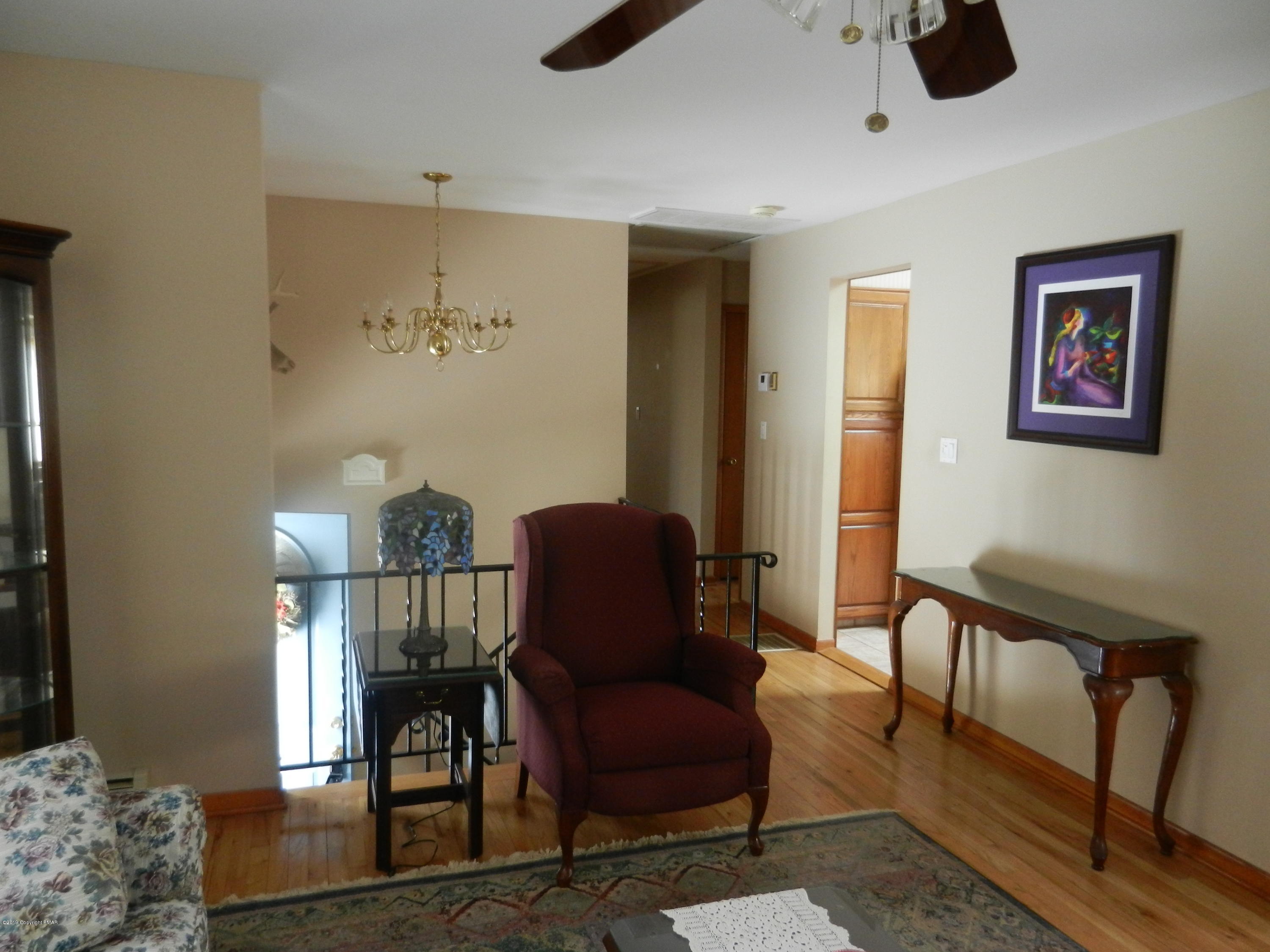 427 Emery Wheel Road Stroudsburg, PA 18360 - Photo 13 of 21 a view of a livingroom with furniture and windows