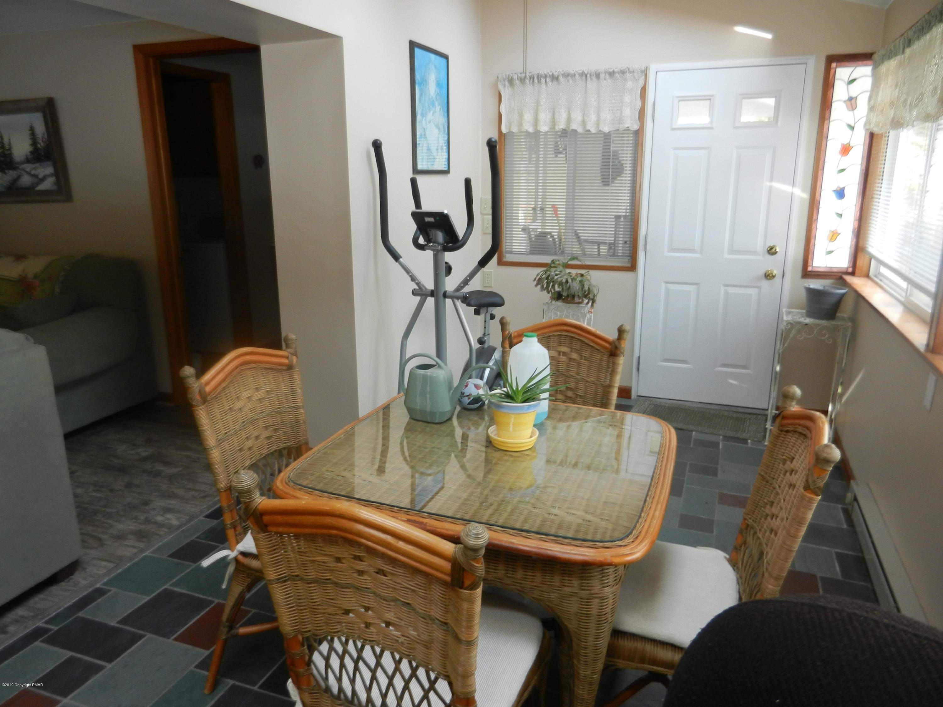 427 Emery Wheel Road Stroudsburg, PA 18360 - Photo 5 of 21 a dining room with furniture and wooden floor