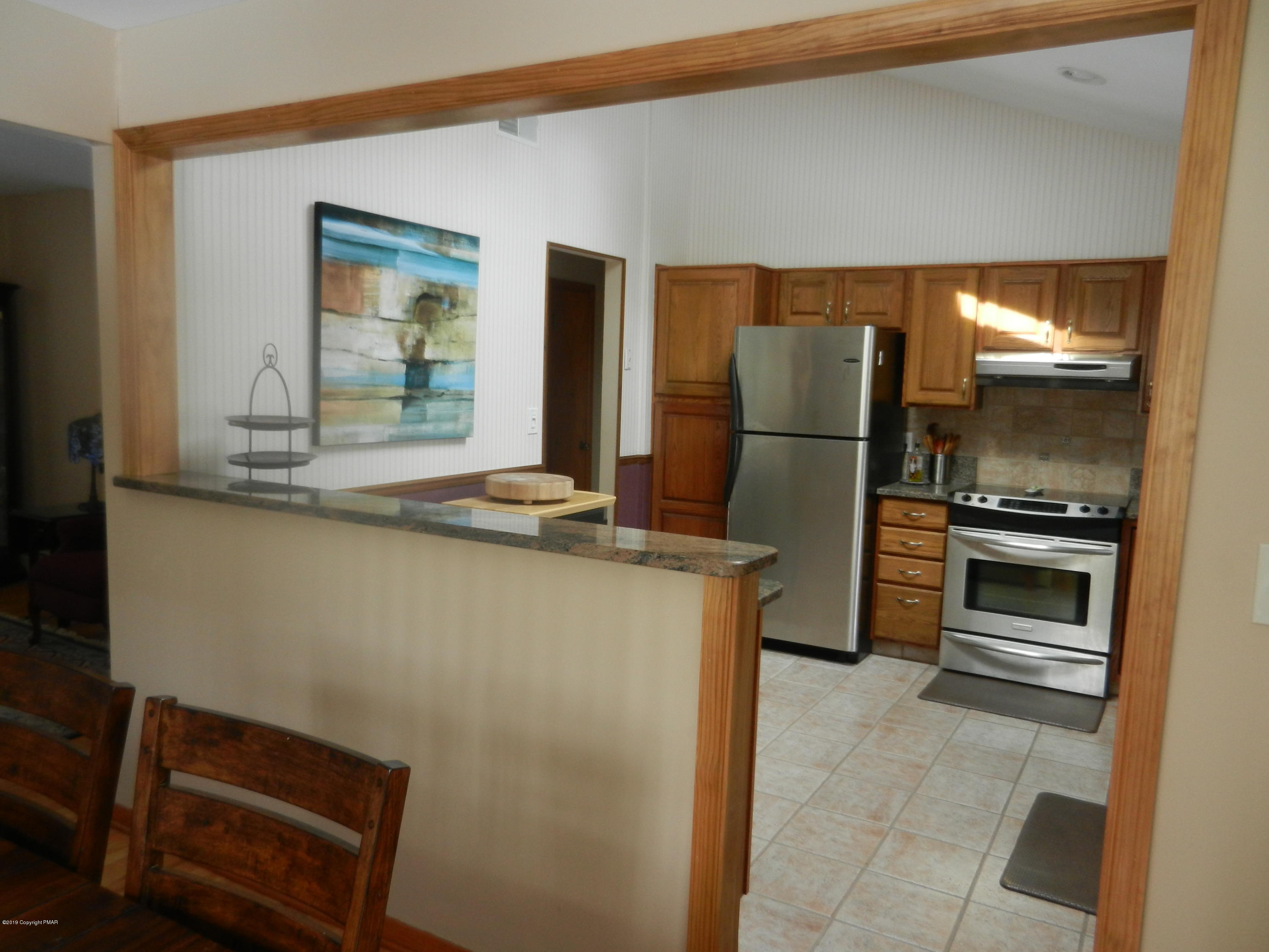 427 Emery Wheel Road Stroudsburg, PA 18360 - Photo 6 of 21 a kitchen with kitchen island a counter top space cabinets and stainless steel appliances