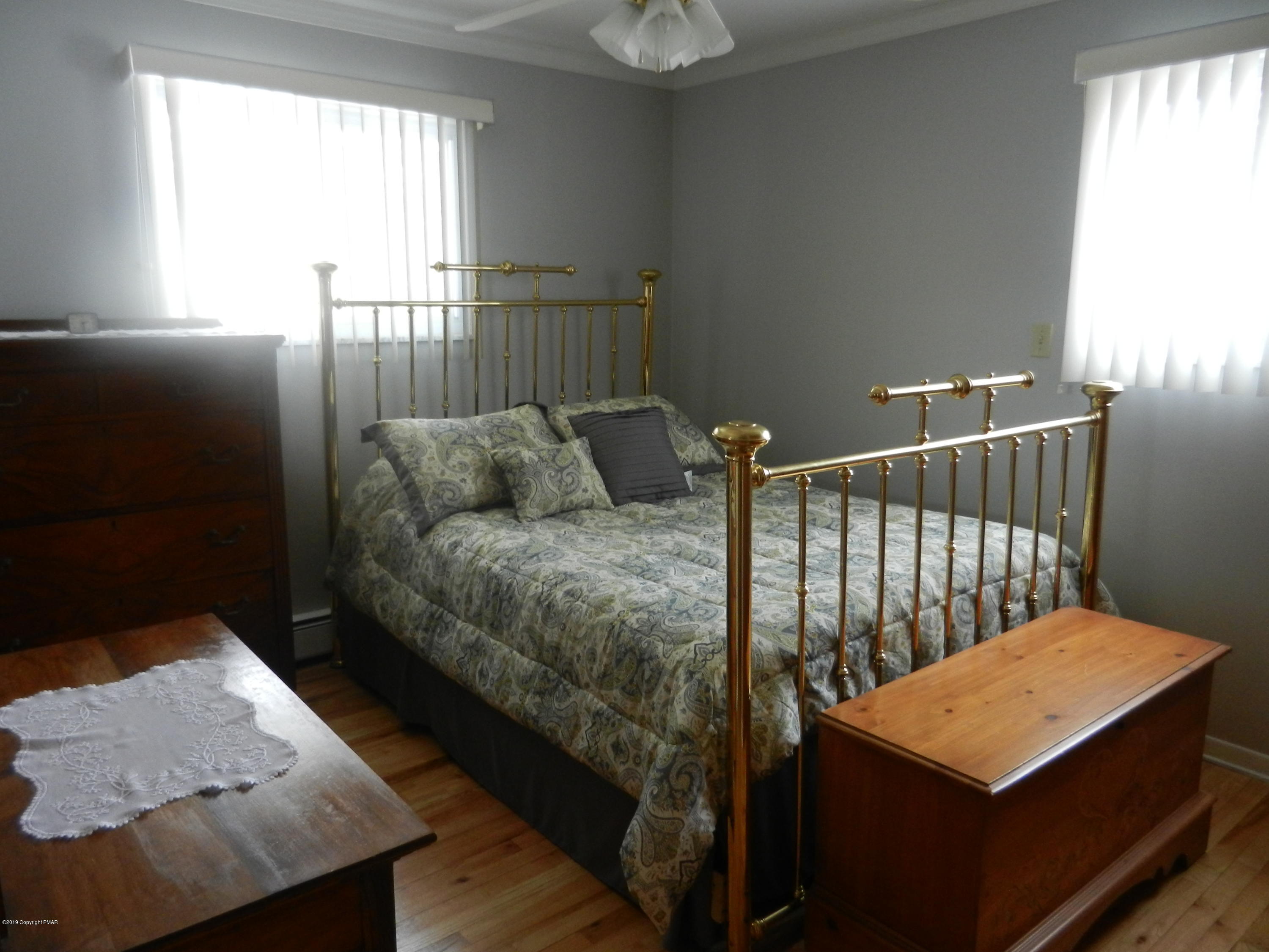 427 Emery Wheel Road Stroudsburg, PA 18360 - Photo 7 of 21 a bedroom with a bed and window