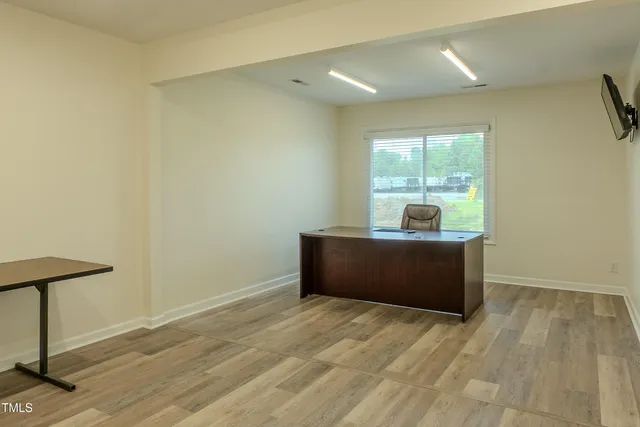 a room with a bed and a window