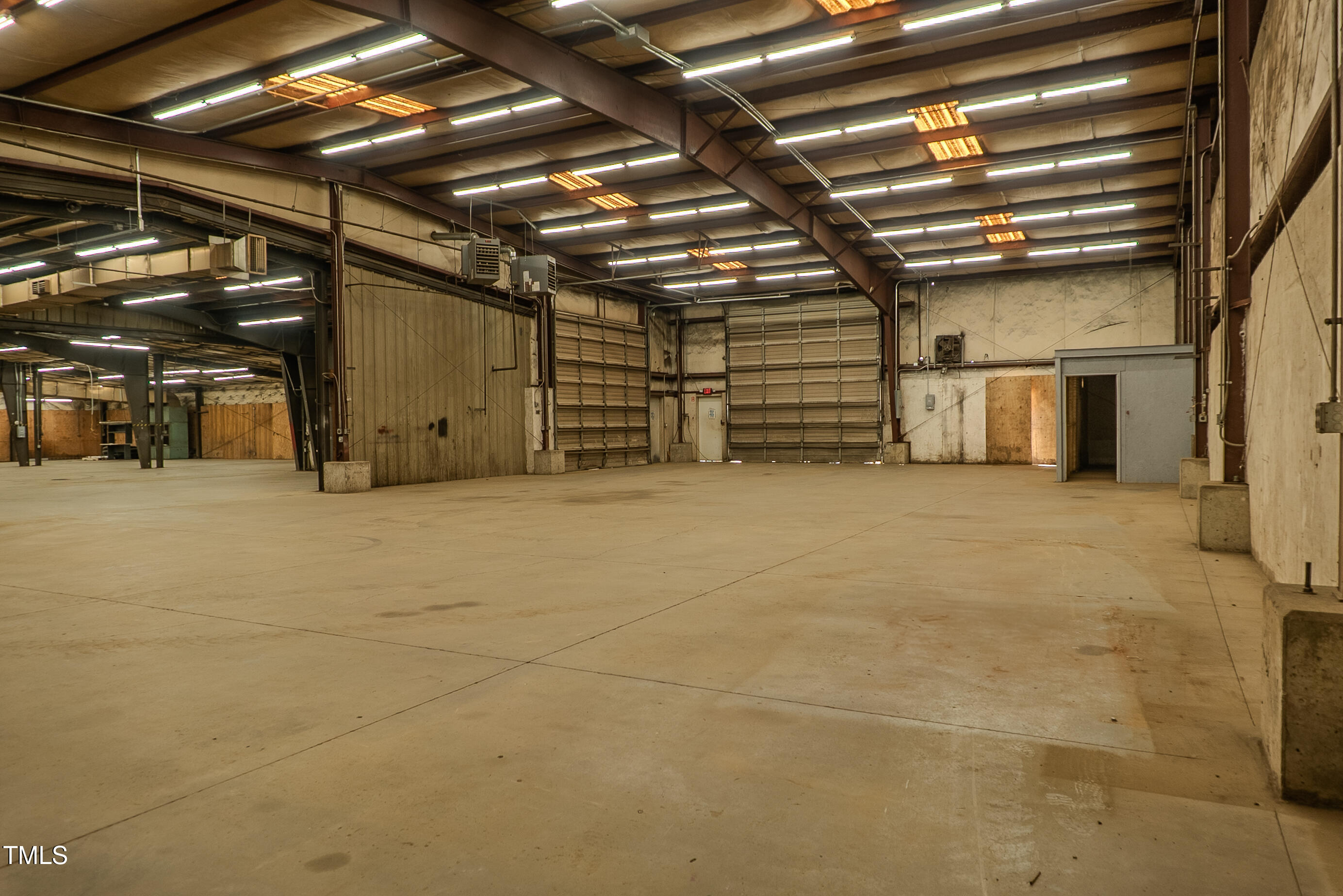 6504 Burlington Road Whitsett, NC 27377 - Photo 29 of 34 a view of an empty room with wooden roof