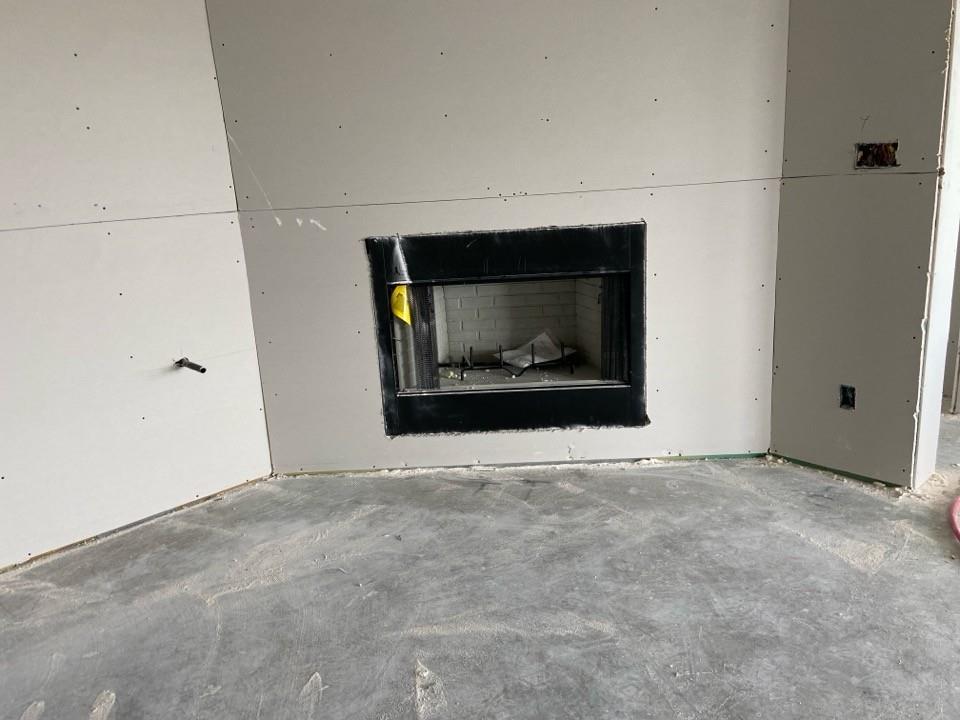 139 Big Sky Road Decatur, TX 76234 - Photo 7 of 12 a view of an empty room with a fireplace