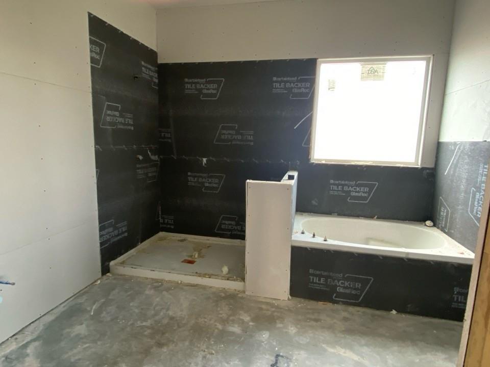 139 Big Sky Road Decatur, TX 76234 - Photo 9 of 12 a bathroom with a bathtub and a shower