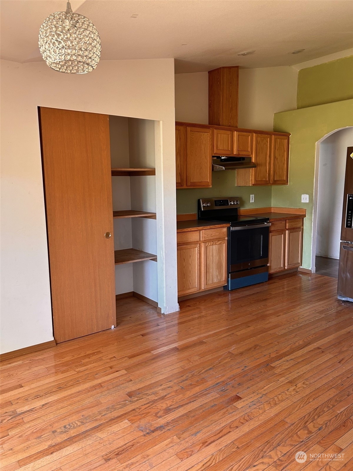 9520 185th Avenue Southwest Rochester, WA 98579 - Photo 14 of 24 a view of kitchen with furniture and wooden floor