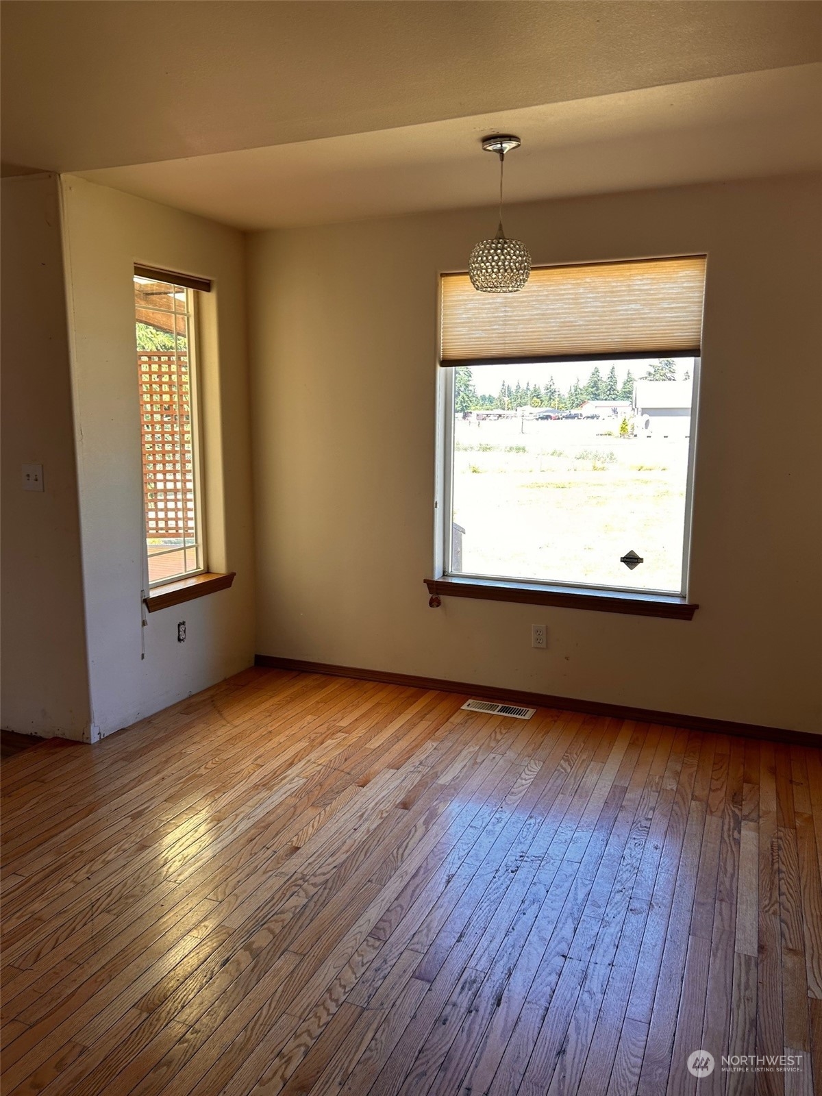 9520 185th Avenue Southwest Rochester, WA 98579 - Photo 15 of 24 an empty room with wooden floor and windows