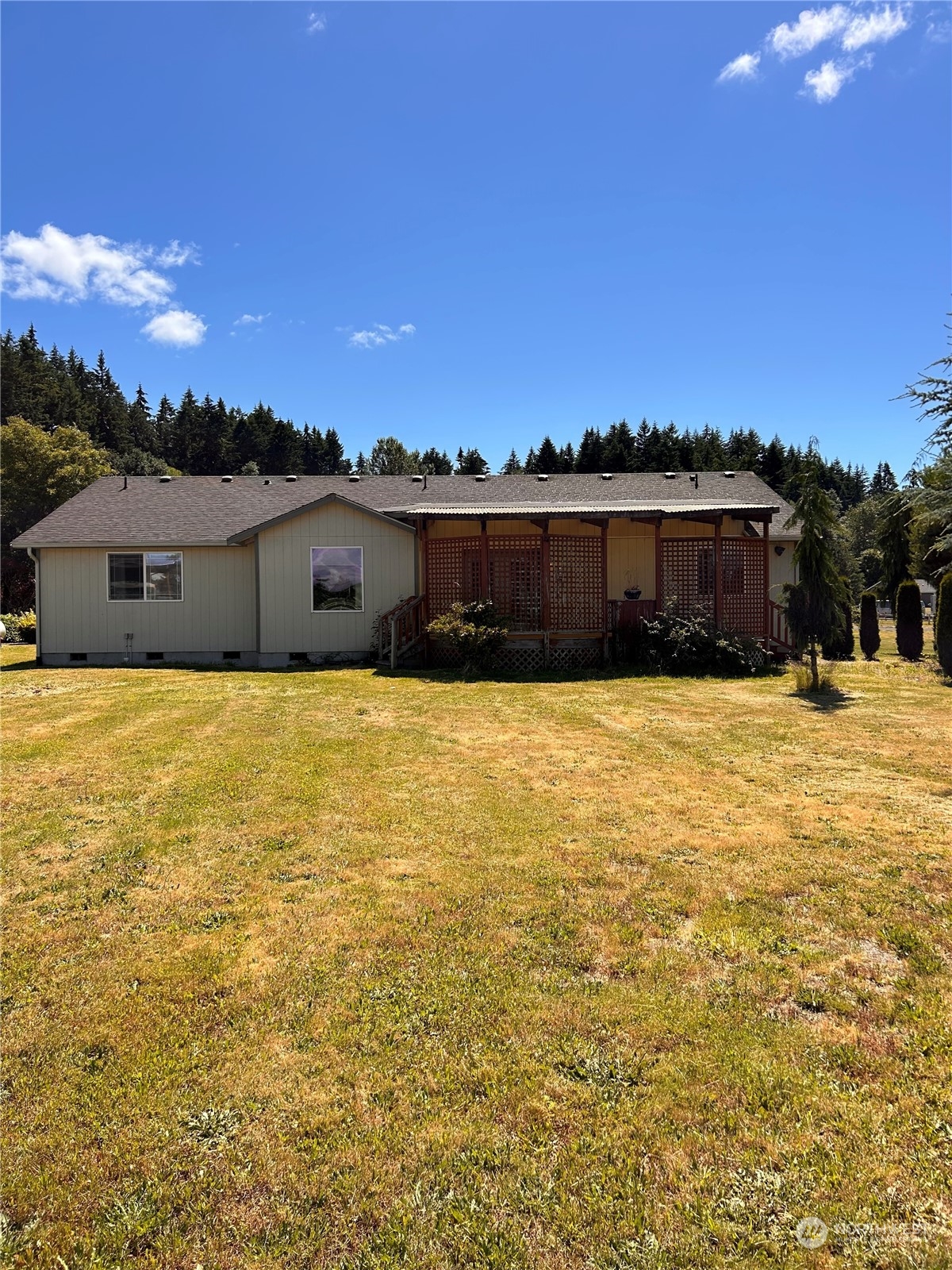 9520 185th Avenue Southwest Rochester, WA 98579 - Photo 4 of 24 a view of a swimming pool with an outdoor seating and a yard