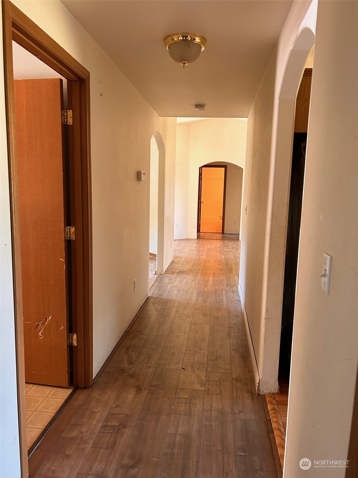9520 185th Avenue Southwest Rochester, WA 98579 - Photo 10 of 24 a view of a hallway with wooden floor and cabinet