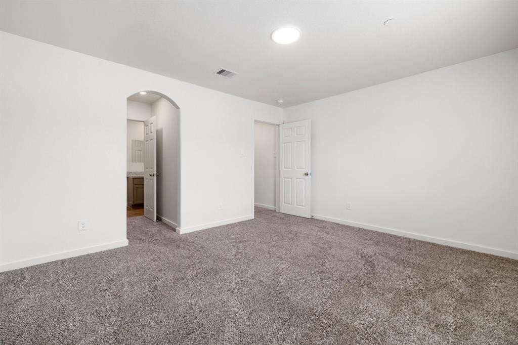 12603 Telge Road, Unit 32 AD Cypress, TX 77429 - Photo 12 of 13 an empty room with closet and mirror
