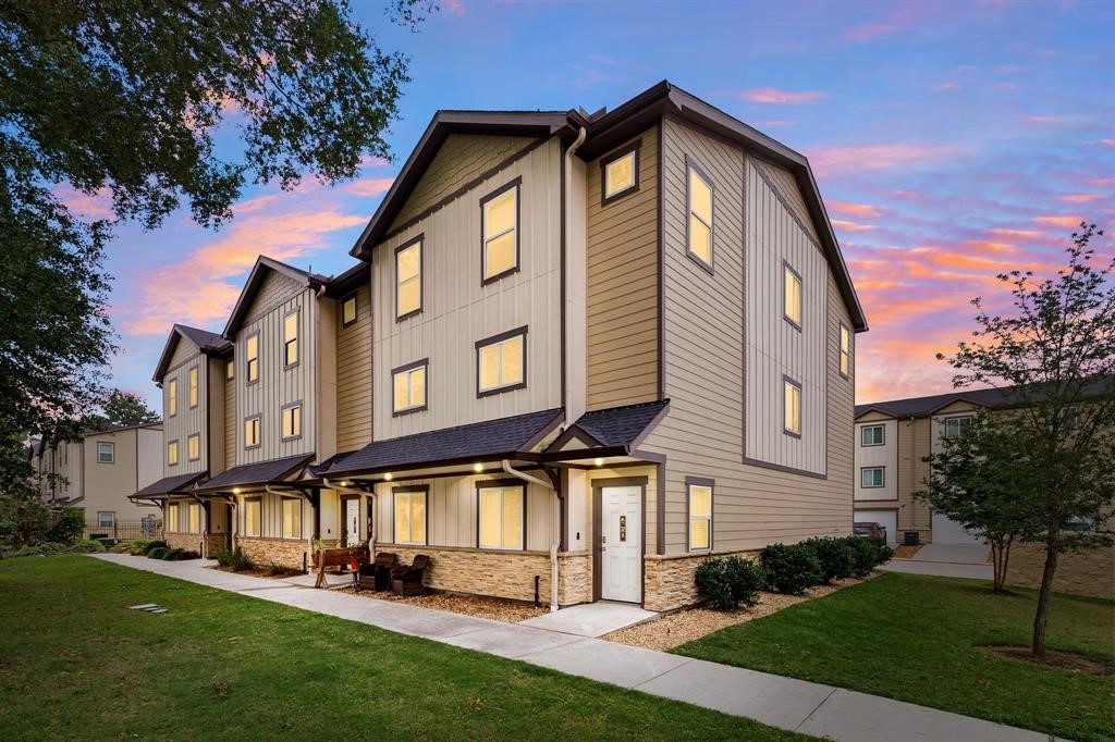 12603 Telge Road, Unit 32 AD Cypress, TX 77429 - Photo 2 of 13 a front view of a house with a yard