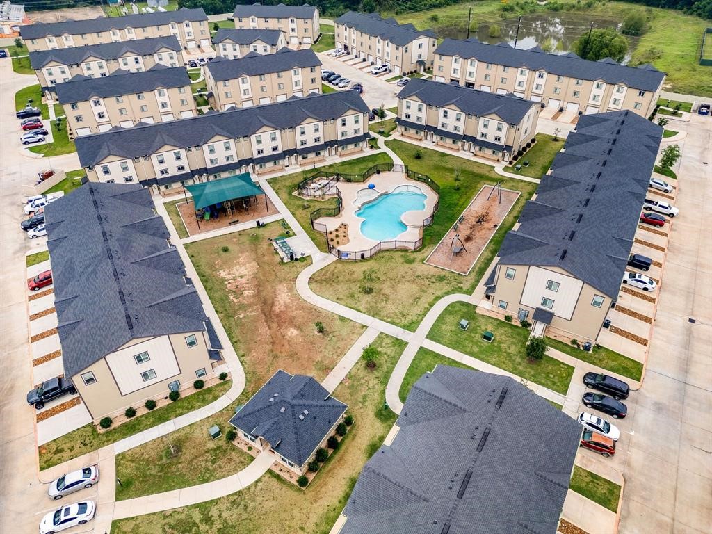 12603 Telge Road, Unit 32 AD Cypress, TX 77429 - Photo 4 of 13 an aerial view of a house with a swimming pool