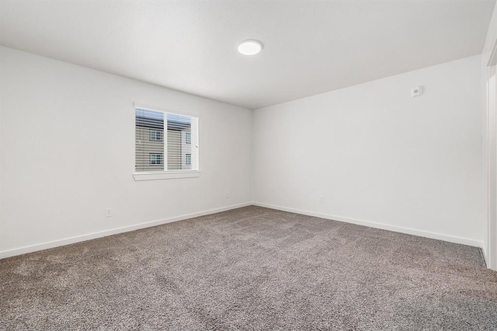 12603 Telge Road, Unit 32 AD Cypress, TX 77429 - Photo 10 of 13 an empty room with a empty space and window