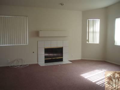 68100 Peladora Road Cathedral City, CA 92234 - Photo 2 of 4 a living room with furniture and a fireplace