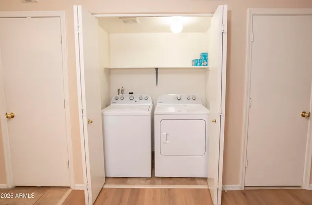a utility room with dryer and washer