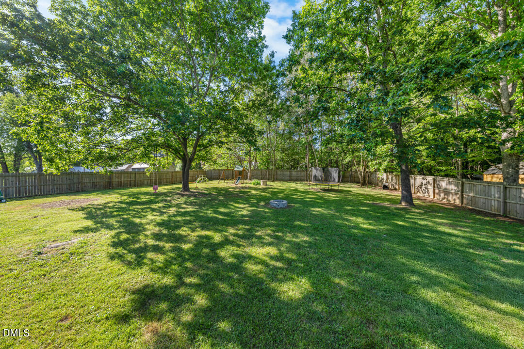 454 Cedar Creek Road Timberlake, NC 27583 - Photo 26 of 39 a view of outdoor space with deck and yard
