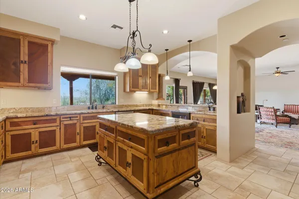 a kitchen with stainless steel appliances granite countertop a stove and a sink
