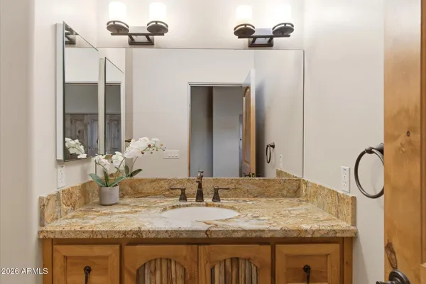 a bathroom with a sink and a mirror